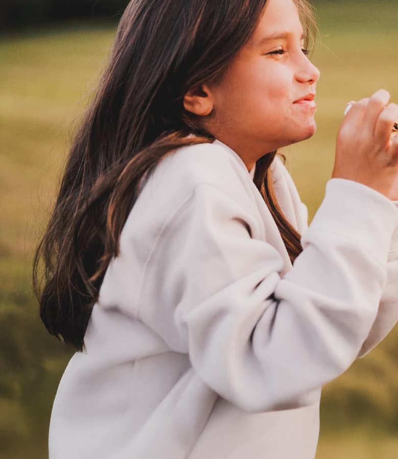 lfac_child-making-a-wish_mobile lfac young camper smiling peacefully while making a wish at sunset during camp evening
